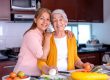 Woman with her senior mother in the kitchen