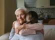 Senior woman embracing caregiver